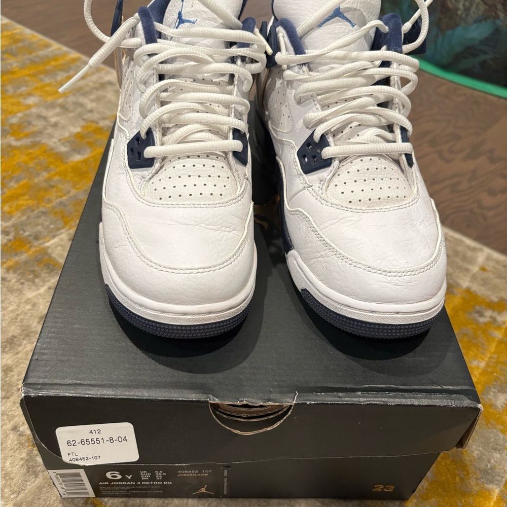 Air Jordan 4 Retro White and Navy Sneakers